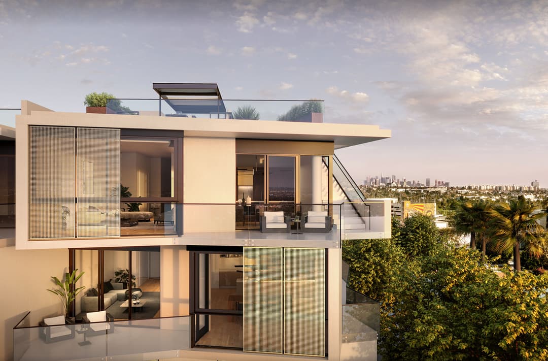 Exterior view of a luxury penthouse residence at The Harland West Hollywood showing a multi-level balcony with glass railings, outdoor seating, and a rooftop terrace with city skyline in the distance.