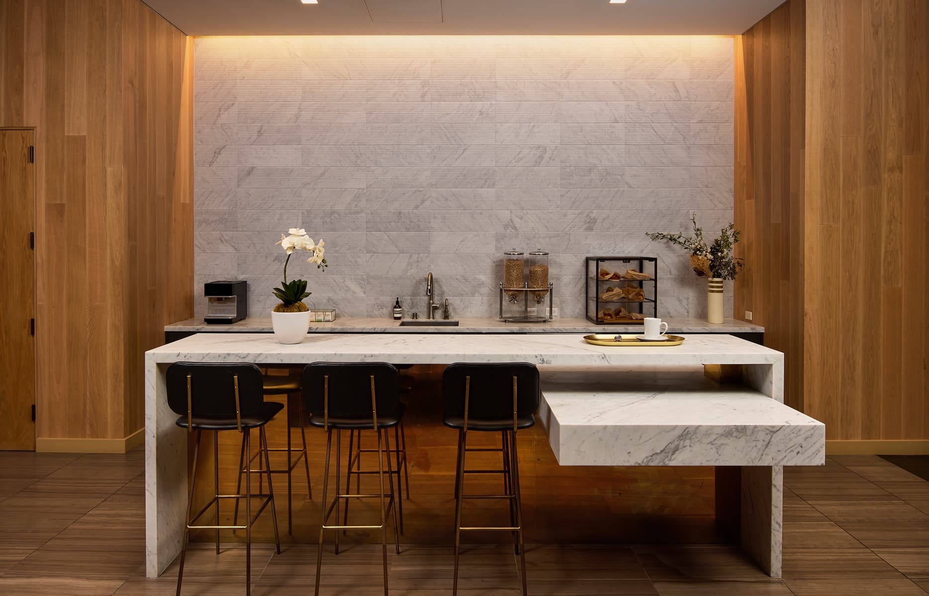 Modern entertainment lounge interior featuring seating areas, high ceilings, and upscale finishes at The Harland.