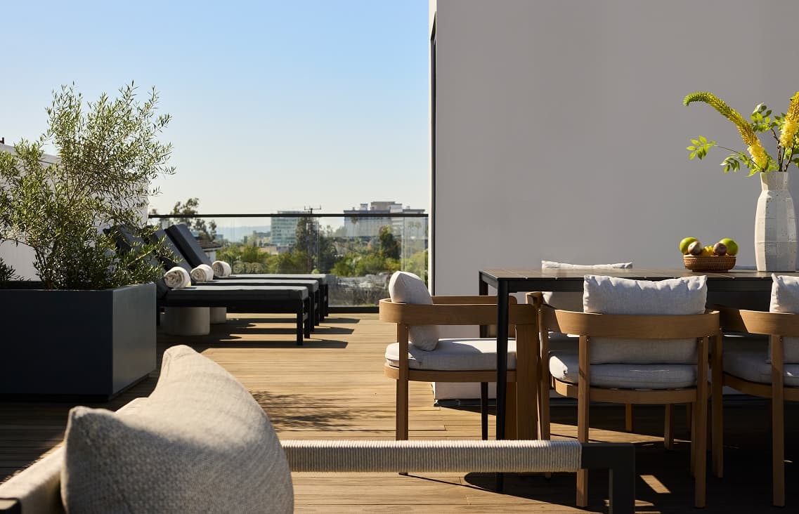 Outdoor terrace of a townhome at the harland including and seating and dining area