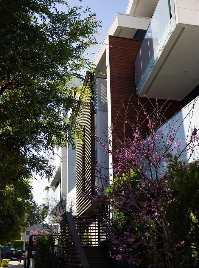 Exterior side angle photograph of The Harland West Hollywood and it's lush landscape